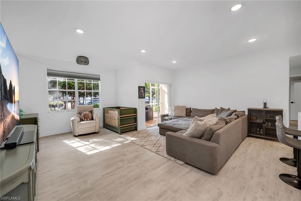 4620 St Croix Lane, Unit 918 Naples, FL 34109 - Photo 3 of 43 a living room with furniture window and fireplace
