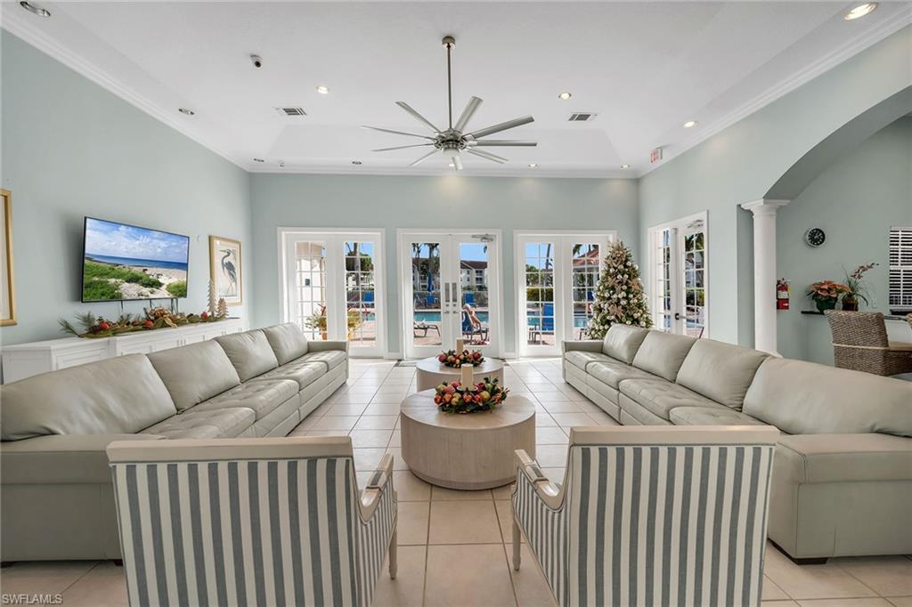 4620 St Croix Lane, Unit 918 Naples, FL 34109 - Photo 32 of 43 a living room with furniture and a large window