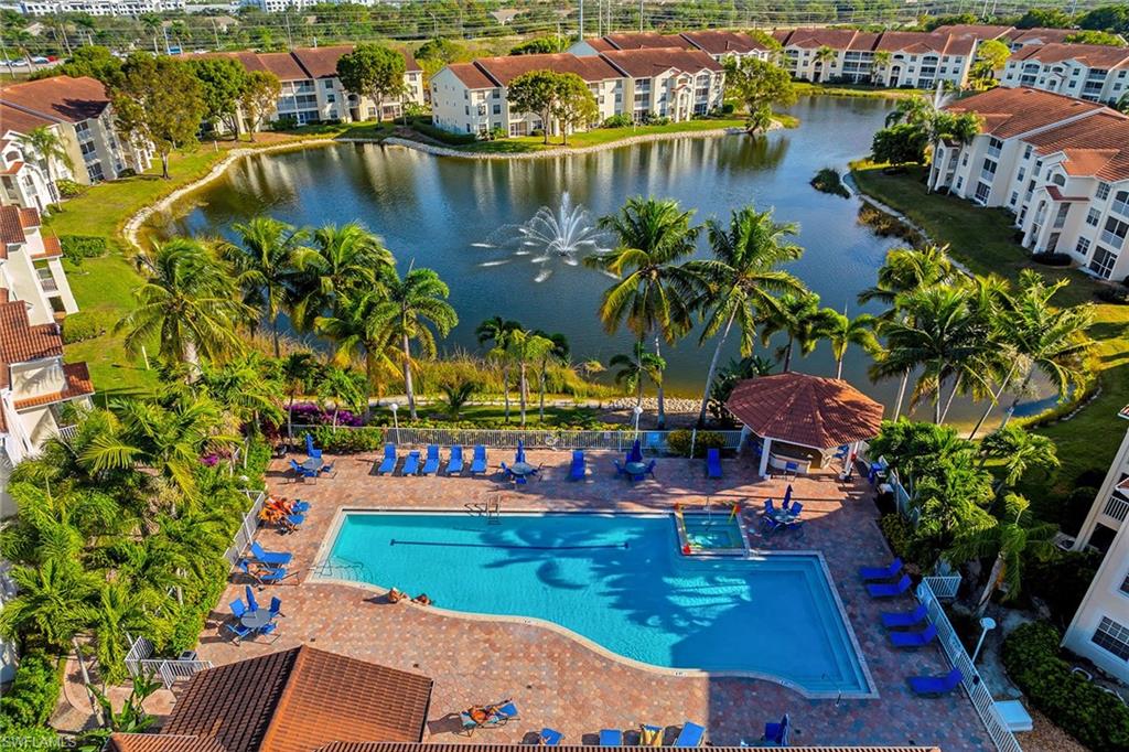 4620 St Croix Lane, Unit 918 Naples, FL 34109 - Photo 40 of 43 an aerial view of residential houses with outdoor space and swimming pool