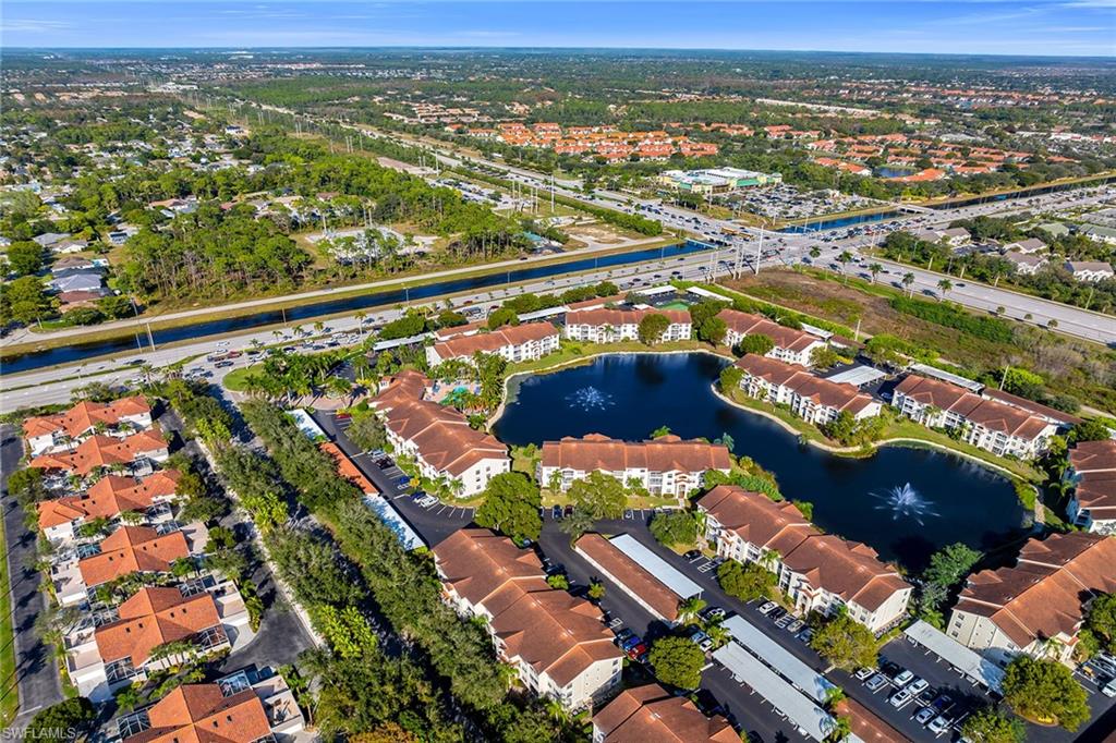4620 St Croix Lane, Unit 918 Naples, FL 34109 - Photo 43 of 43 an aerial view of residential houses with outdoor space