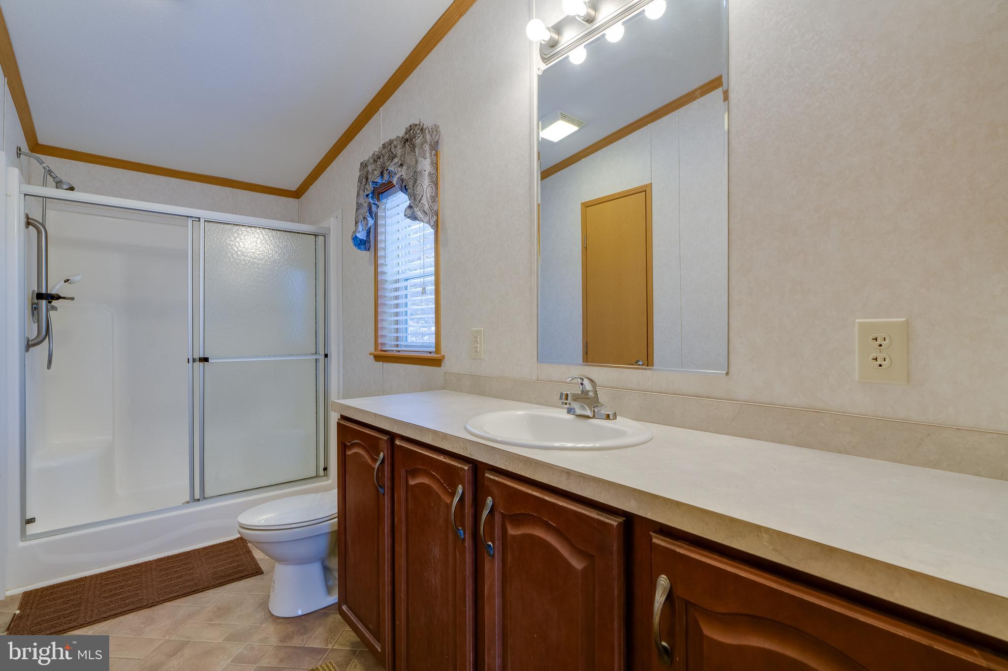 2208 Herb Road Temple, PA 19560 - Photo 17 of 34 a bathroom with a sink a vanity and a mirror