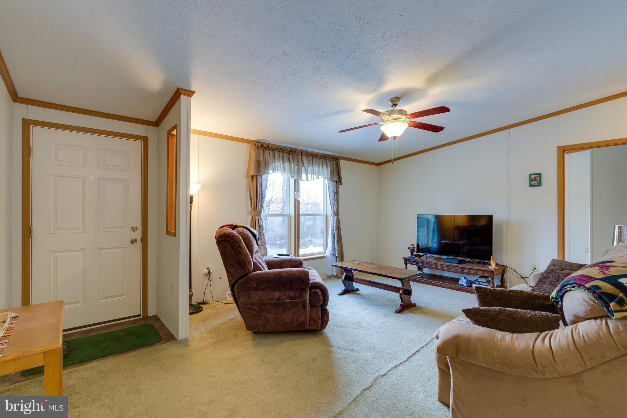 2208 Herb Road Temple, PA 19560 - Photo 10 of 34 a living room with furniture and a flat screen tv