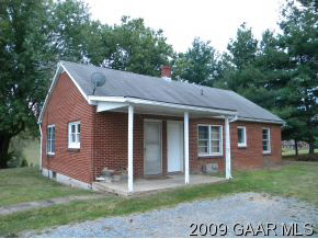 249 Howardsville Road Staunton, VA 24401 - Photo 2 of 10 a view of a house with a yard plants and large tree