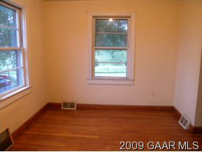 249 Howardsville Road Staunton, VA 24401 - Photo 5 of 10 an empty room with wooden floor and windows