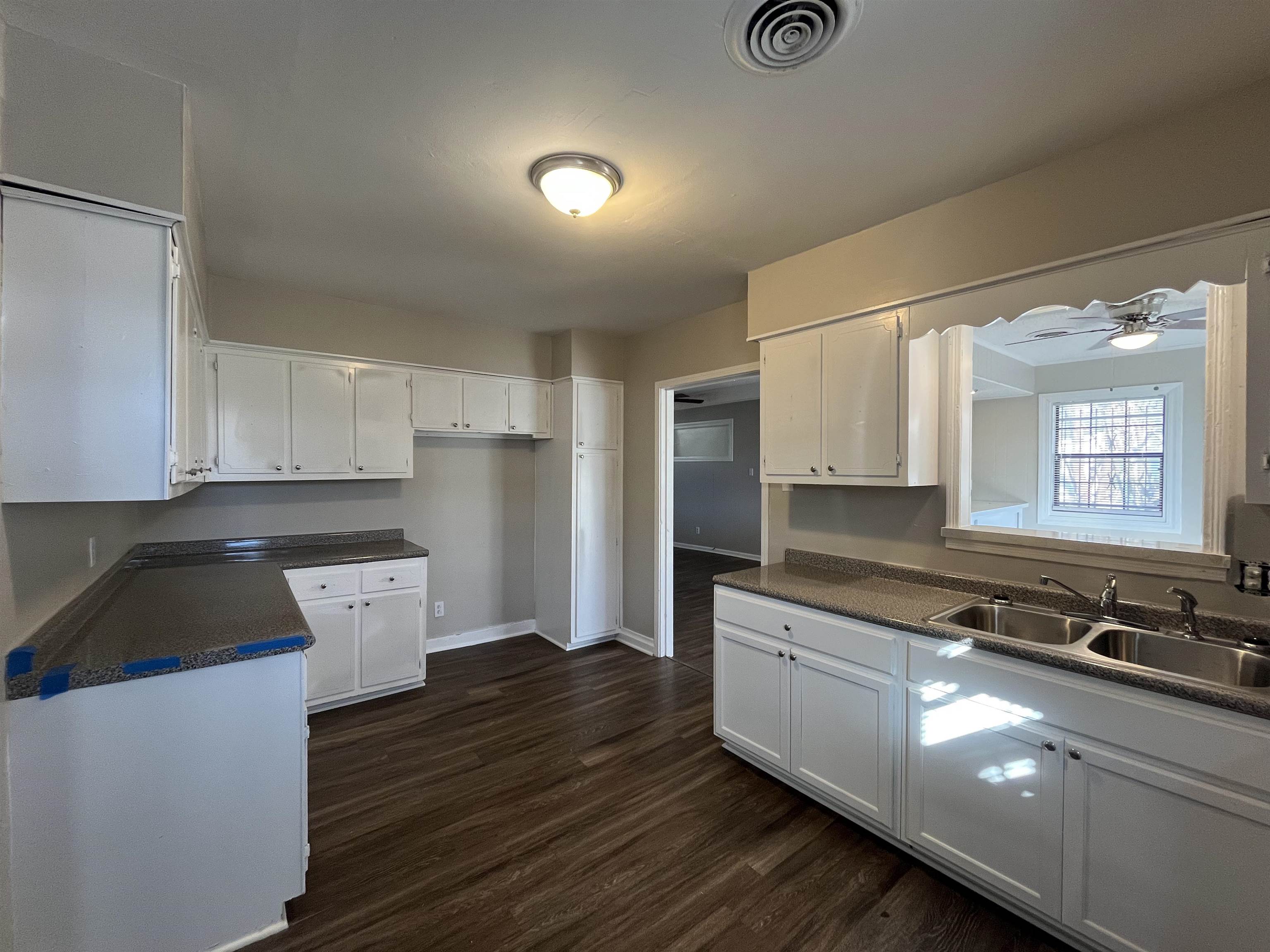 1362 Springdale Street Memphis, TN 38108 - Photo 5 of 16 a kitchen with a sink and a stove top oven