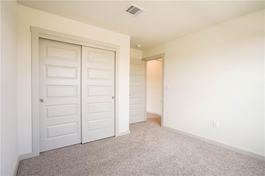 2341 Gabriels Horn Road Leander, TX 78641 - Photo 8 of 20 Unfurnished bedroom featuring carpet flooring and a closet