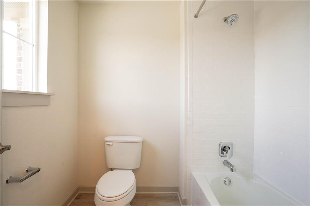 2341 Gabriels Horn Road Leander, TX 78641 - Photo 10 of 20 Bathroom featuring toilet and tub / shower combination