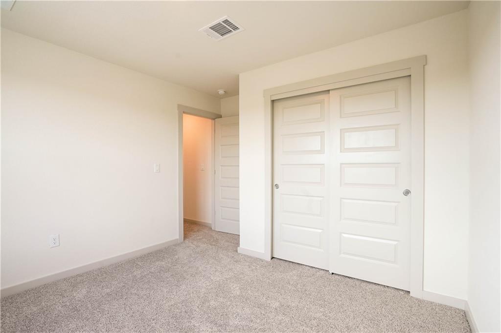 2341 Gabriels Horn Road Leander, TX 78641 - Photo 11 of 20 Unfurnished bedroom featuring light colored carpet and a closet