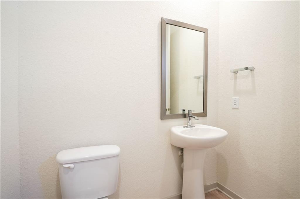 2341 Gabriels Horn Road Leander, TX 78641 - Photo 6 of 20 Half bathroom featuring a textured wall