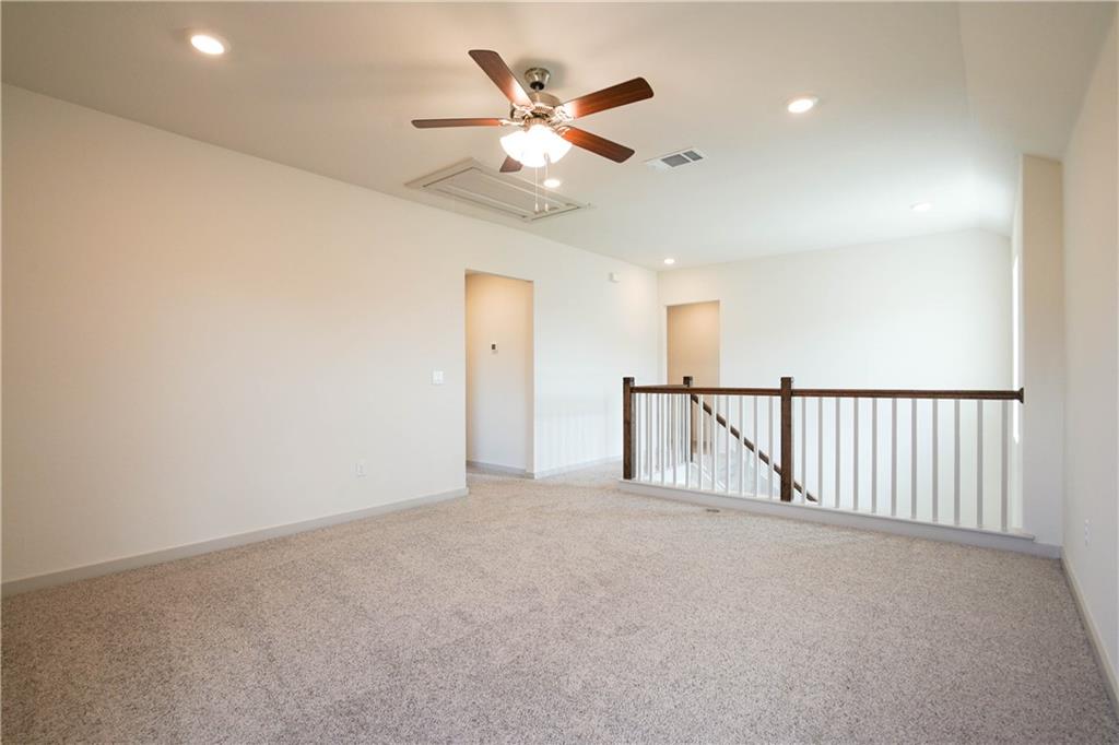 2341 Gabriels Horn Road Leander, TX 78641 - Photo 7 of 20 Unfurnished room with light colored carpet and recessed lighting