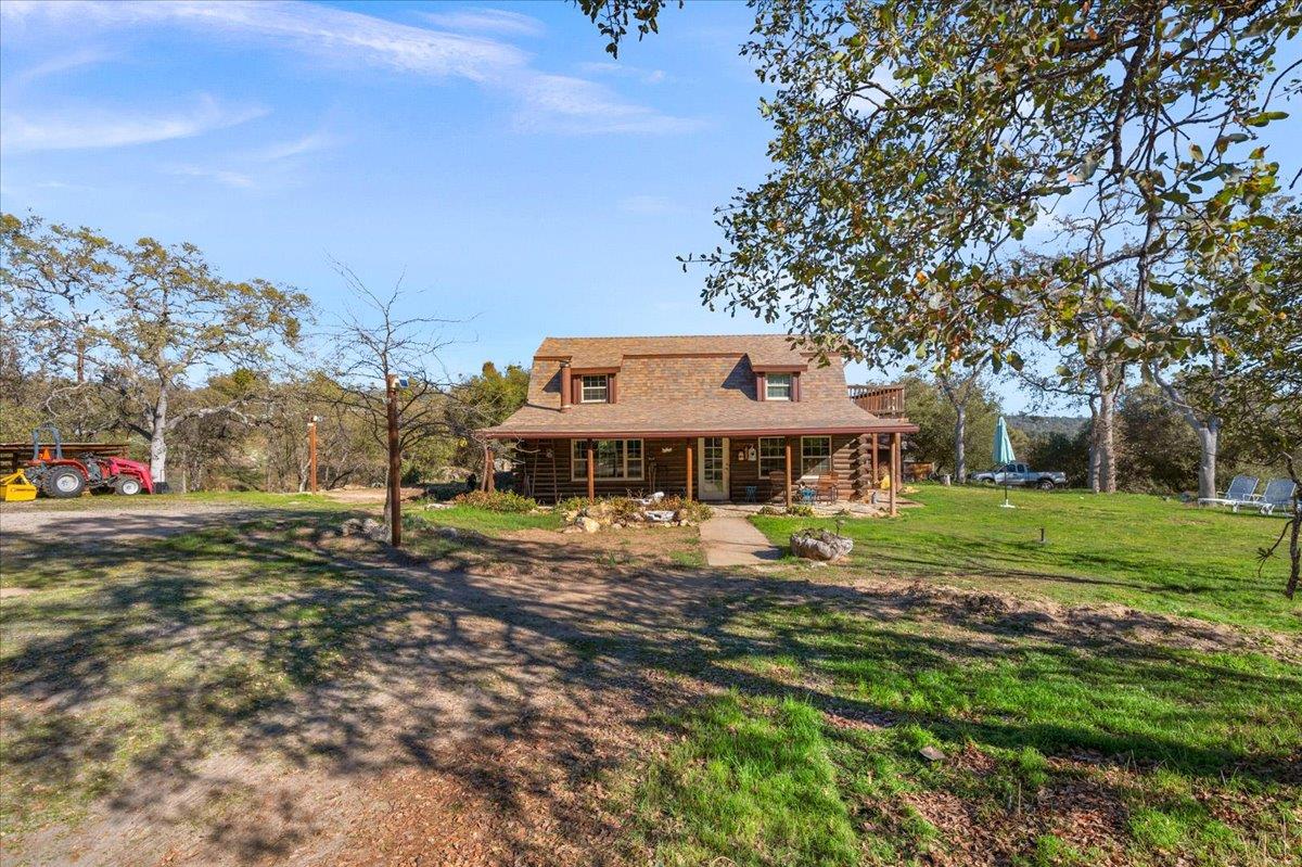 45522 Windmill Road Coarsegold, CA 93614 - Photo 4 of 74 a view of a house with a yard