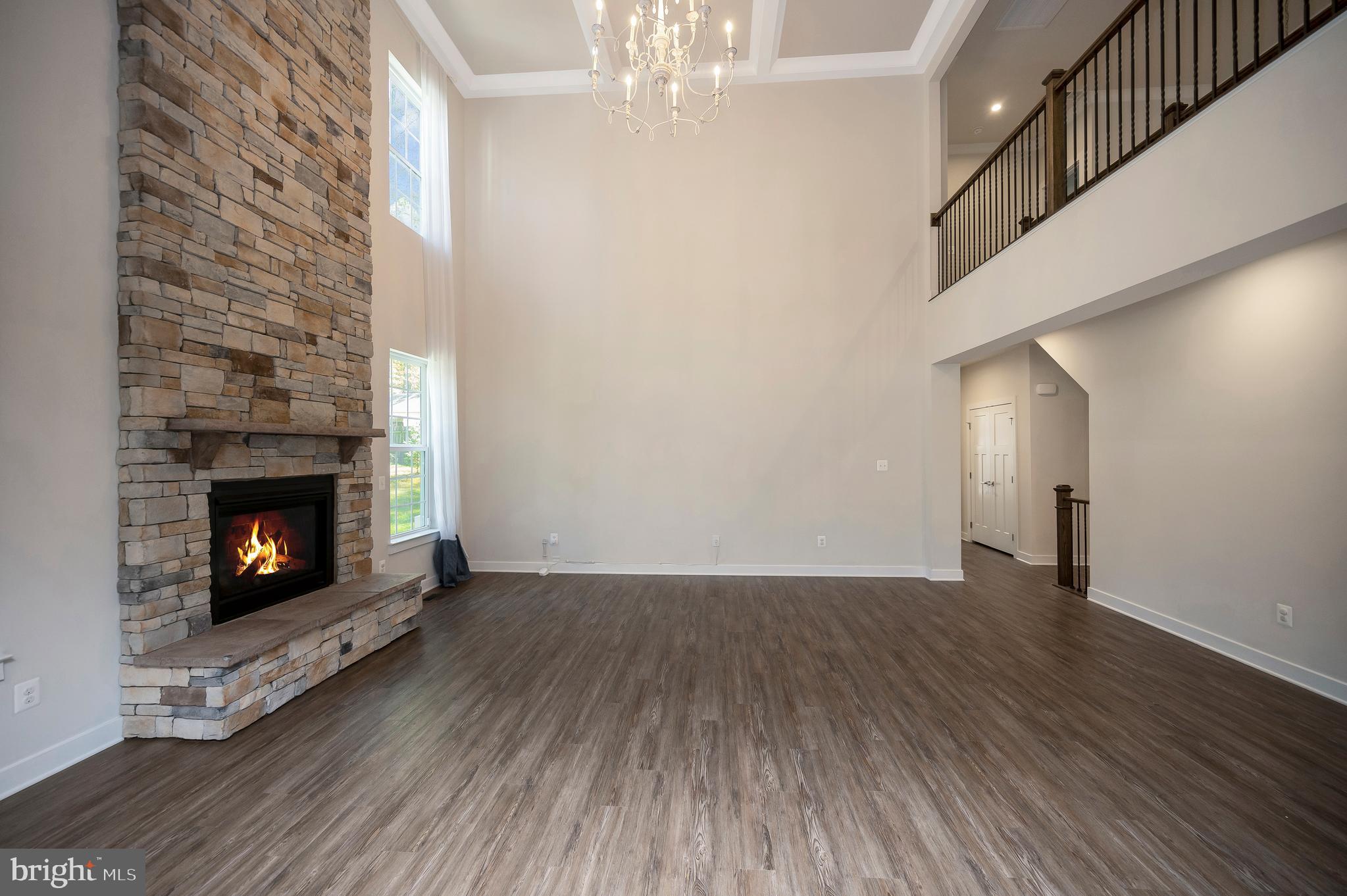 34 Oak Road Stafford, VA 22556 - Photo 15 of 39 a view of an empty room with wooden floor fireplace and a window