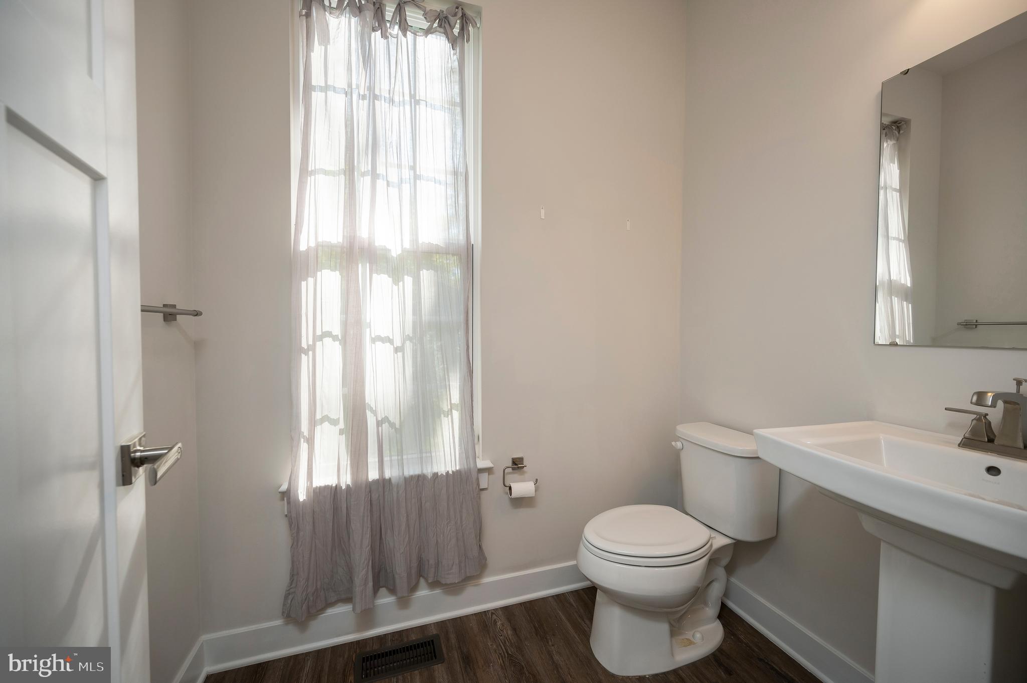 34 Oak Road Stafford, VA 22556 - Photo 17 of 39 a bathroom with a toilet sink and mirror