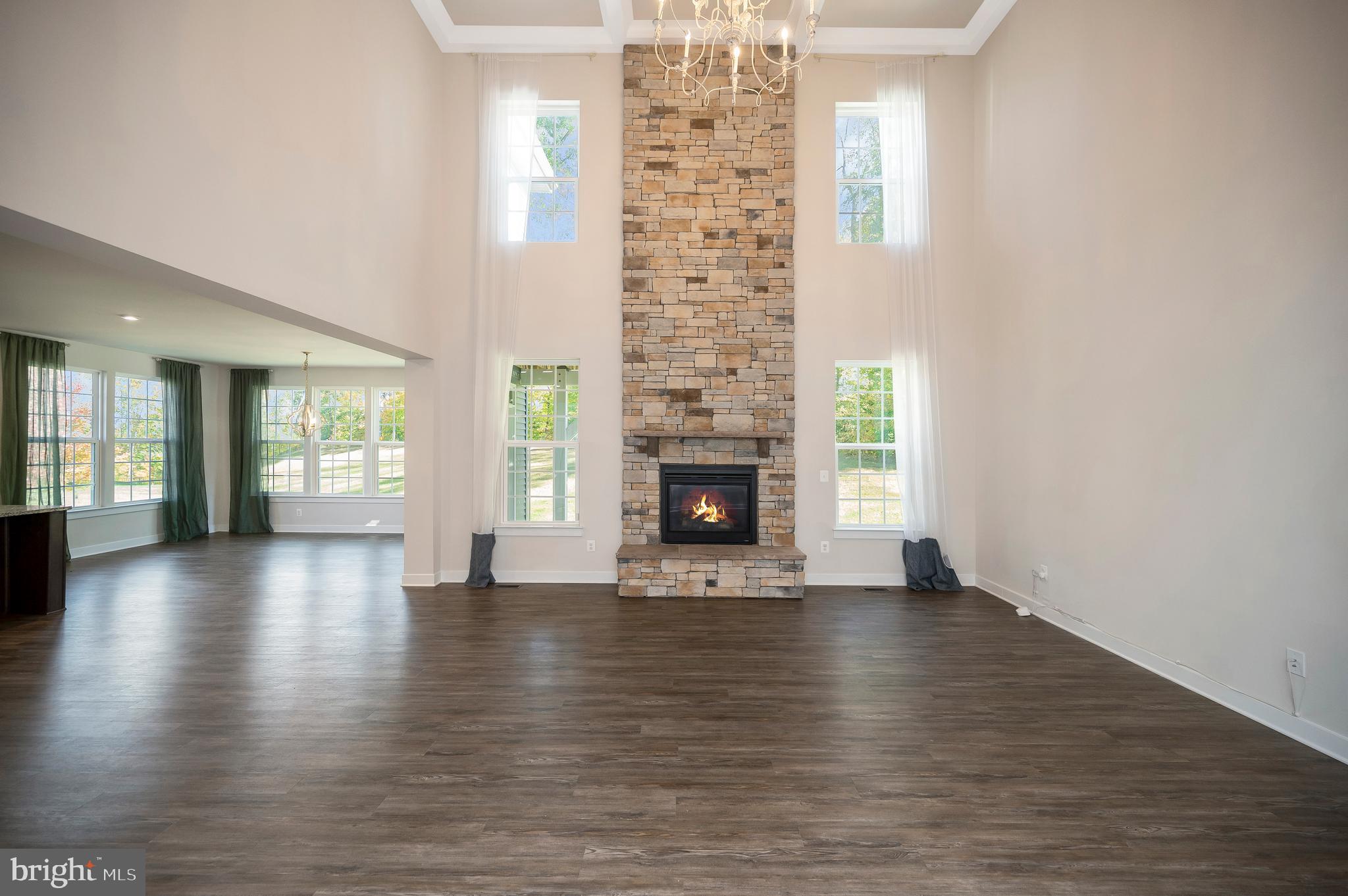 34 Oak Road Stafford, VA 22556 - Photo 3 of 39 an empty room with wooden floor and fireplace