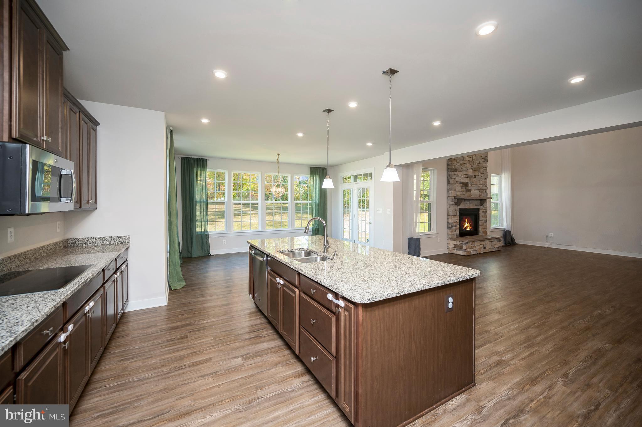 34 Oak Road Stafford, VA 22556 - Photo 4 of 39 a large kitchen with stainless steel appliances granite countertop a large counter top and a wooden floors