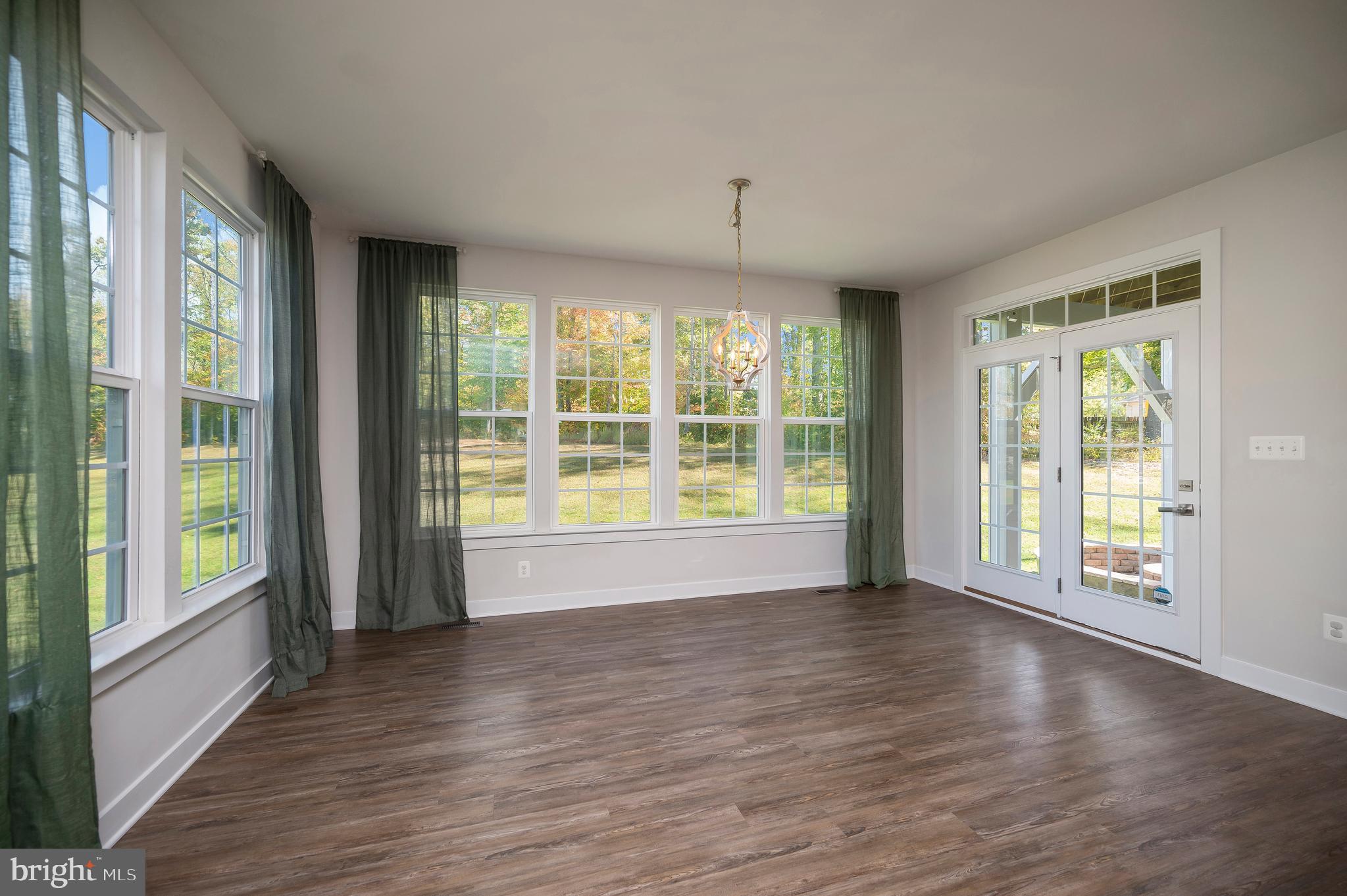 34 Oak Road Stafford, VA 22556 - Photo 7 of 39 a view of an empty room with wooden floor and a window