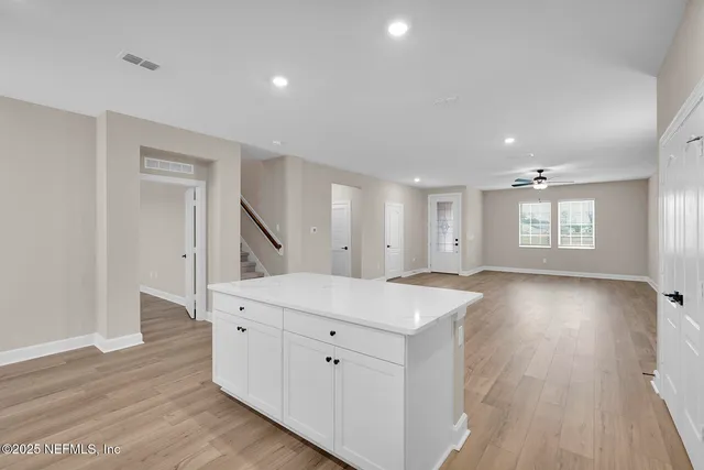 a view of a kitchen and a sink a window