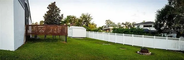 a view of a chair and table in the yard
