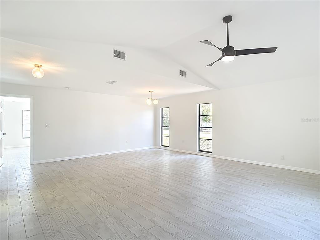 7478 Dundee Way Weeki Wachee, FL 34613 - Photo 12 of 52 a view of an empty room with a window