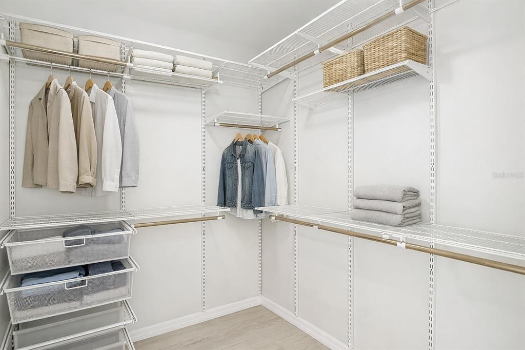 7478 Dundee Way Weeki Wachee, FL 34613 - Photo 28 of 52 a view of walk in closet with empty racks