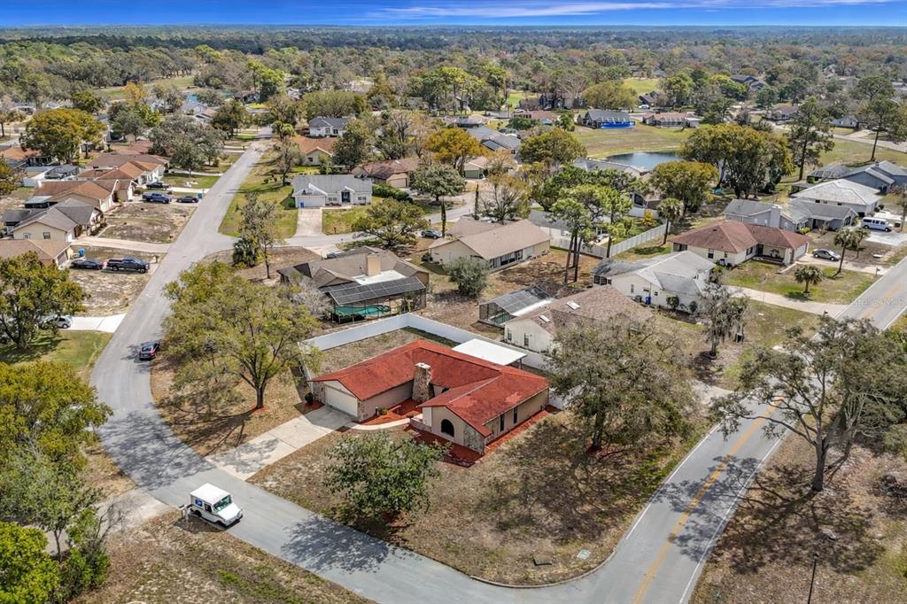 7478 Dundee Way Weeki Wachee, FL 34613 - Photo 3 of 52 an aerial view of residential houses with outdoor space