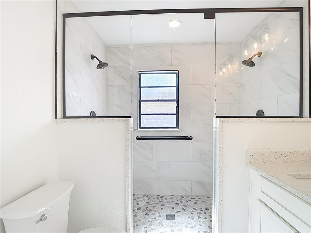 7478 Dundee Way Weeki Wachee, FL 34613 - Photo 33 of 52 a bathroom with a shower and a sink