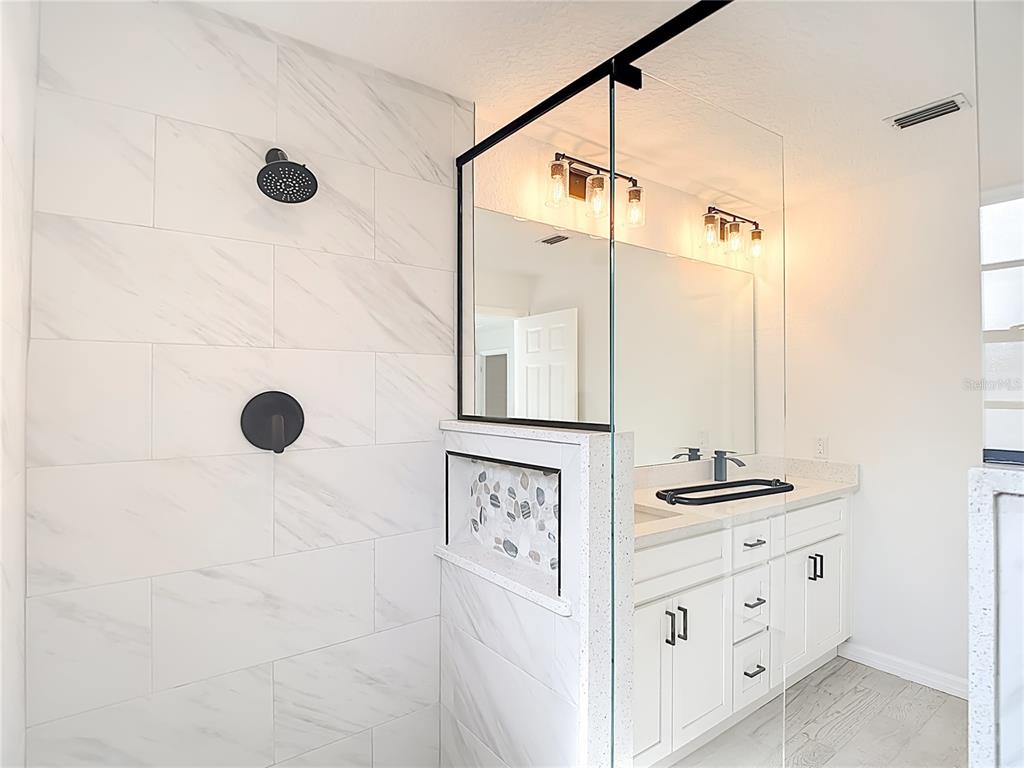 7478 Dundee Way Weeki Wachee, FL 34613 - Photo 34 of 52 a view of bathroom with a shower