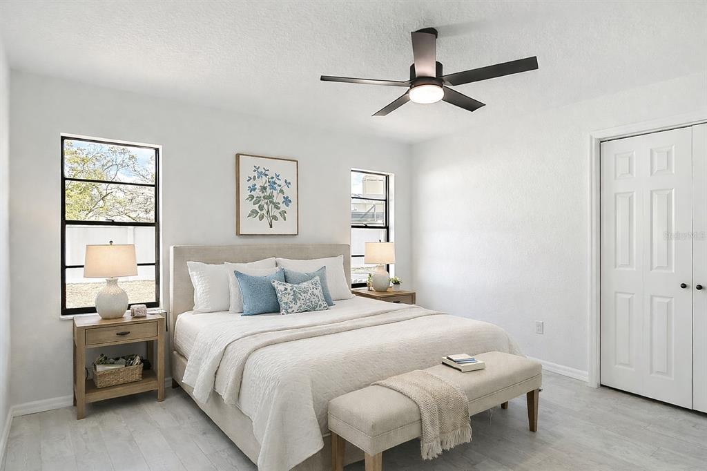 7478 Dundee Way Weeki Wachee, FL 34613 - Photo 36 of 52 a bedroom with a bed and window