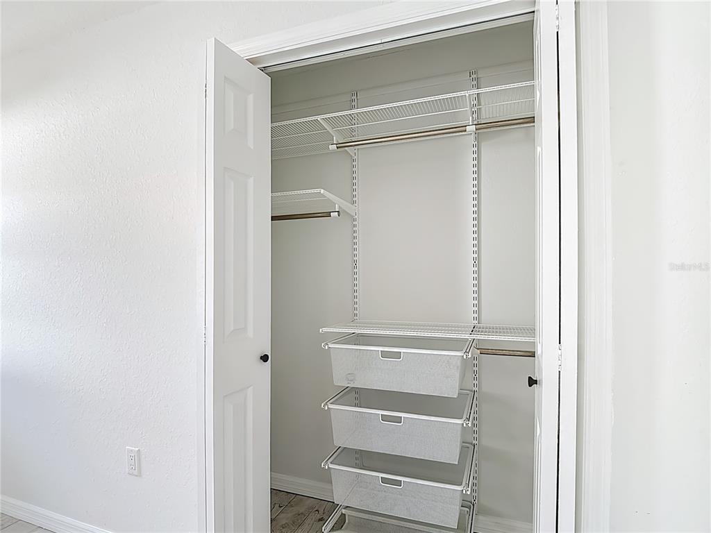 7478 Dundee Way Weeki Wachee, FL 34613 - Photo 38 of 52 a view of walk in closet with empty racks