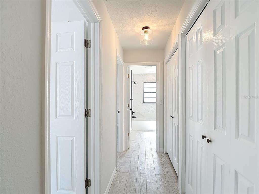 7478 Dundee Way Weeki Wachee, FL 34613 - Photo 40 of 52 a view of a bathroom from the hallway