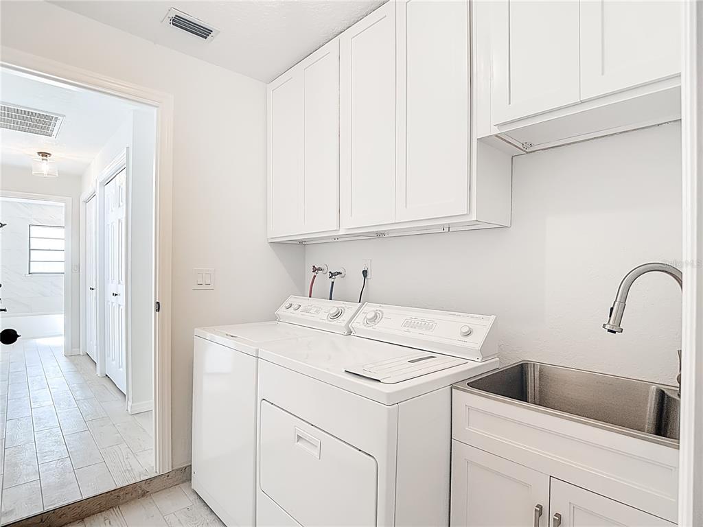 7478 Dundee Way Weeki Wachee, FL 34613 - Photo 44 of 52 a view of a storage and utility room with a sink