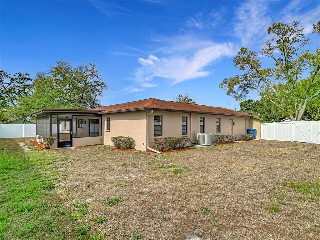 7478 Dundee Way Weeki Wachee, FL 34613 - Photo 49 of 52 a house with trees in the background