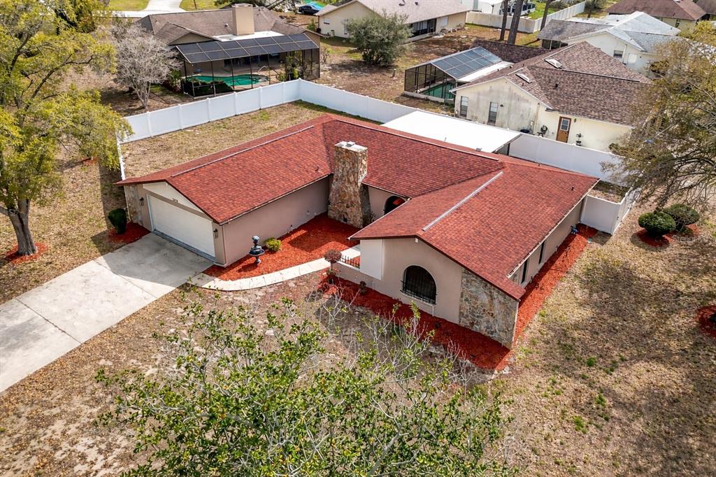 7478 Dundee Way Weeki Wachee, FL 34613 - Photo 52 of 52 an aerial view of a house with a yard
