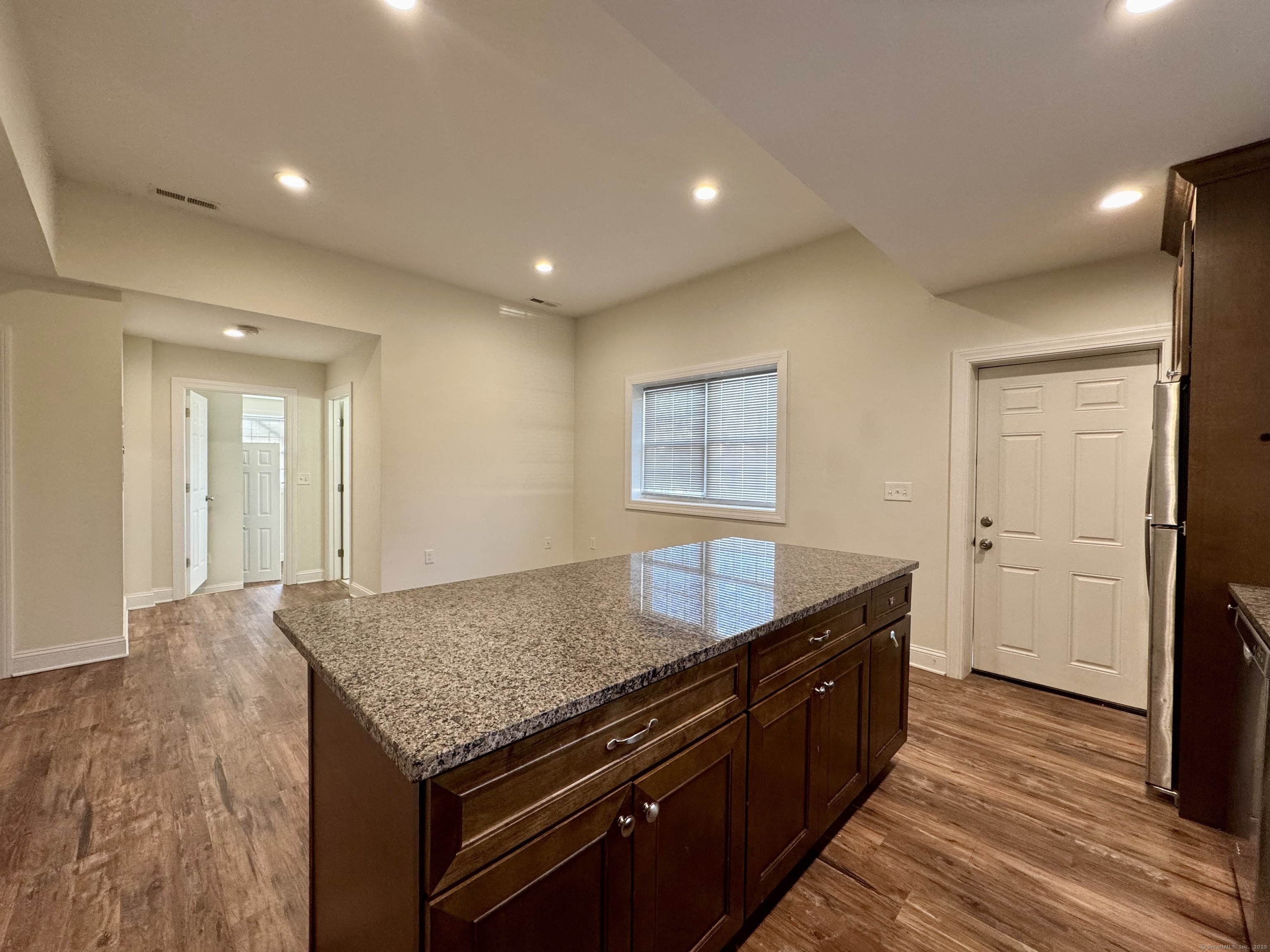 950 Lindley Street Bridgeport, CT 06606 - Photo 5 of 14 a kitchen with stainless steel appliances granite countertop a sink and a refrigerator