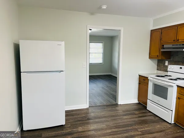 a view of kitchen and wooden floor