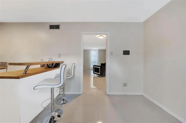 an entryway with a kitchen