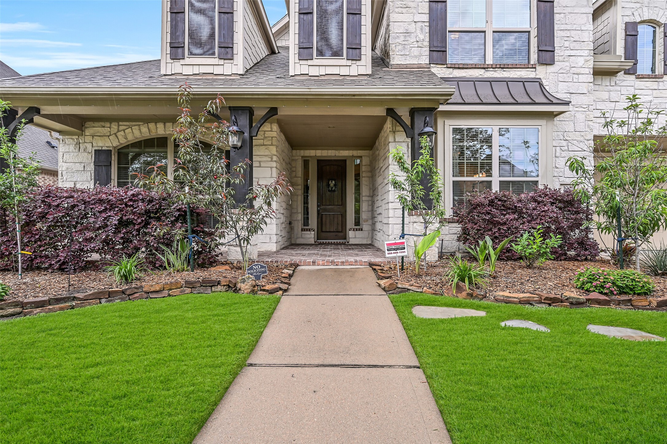 1008 Point Isabel Lane Friendswood, TX 77546 - Photo 4 of 50 As you approach the covered front porch, take a minute to notice the striking stonework, shaker shingle detailing, charming wood shutters, and professional landscaping that surround the oversized front porch with space for a setee or swing.