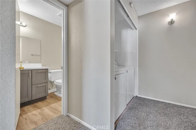 a view of a bathroom from the hallway