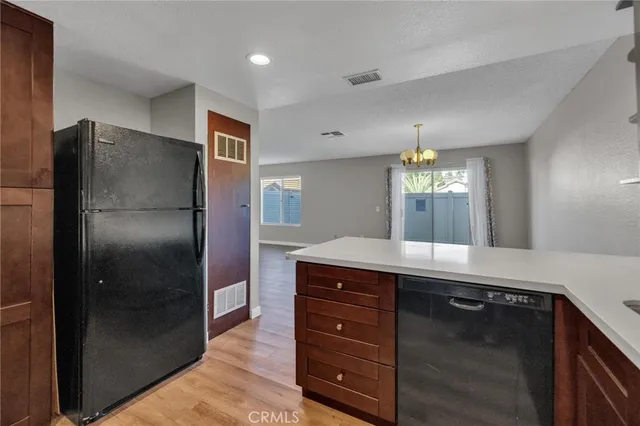 a kitchen with a refrigerator and a sink