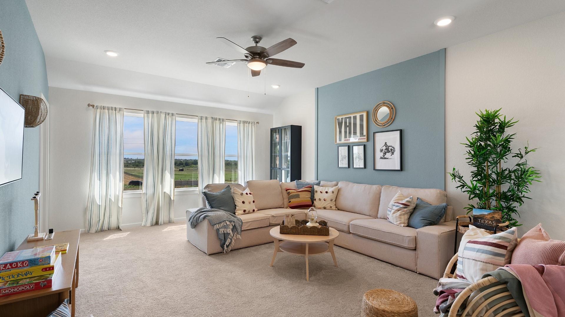 25812 Jasmine Sprig Lane Elgin, TX 78621 - Photo 19 of 33 Unwind in this generously proportioned living area, featuring numerous windows and ample recessed lighting.