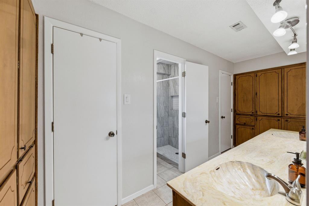224 Overcrest Drive Benbrook, TX 76126 - Photo 20 of 39 a bed room with a bed and a mirror