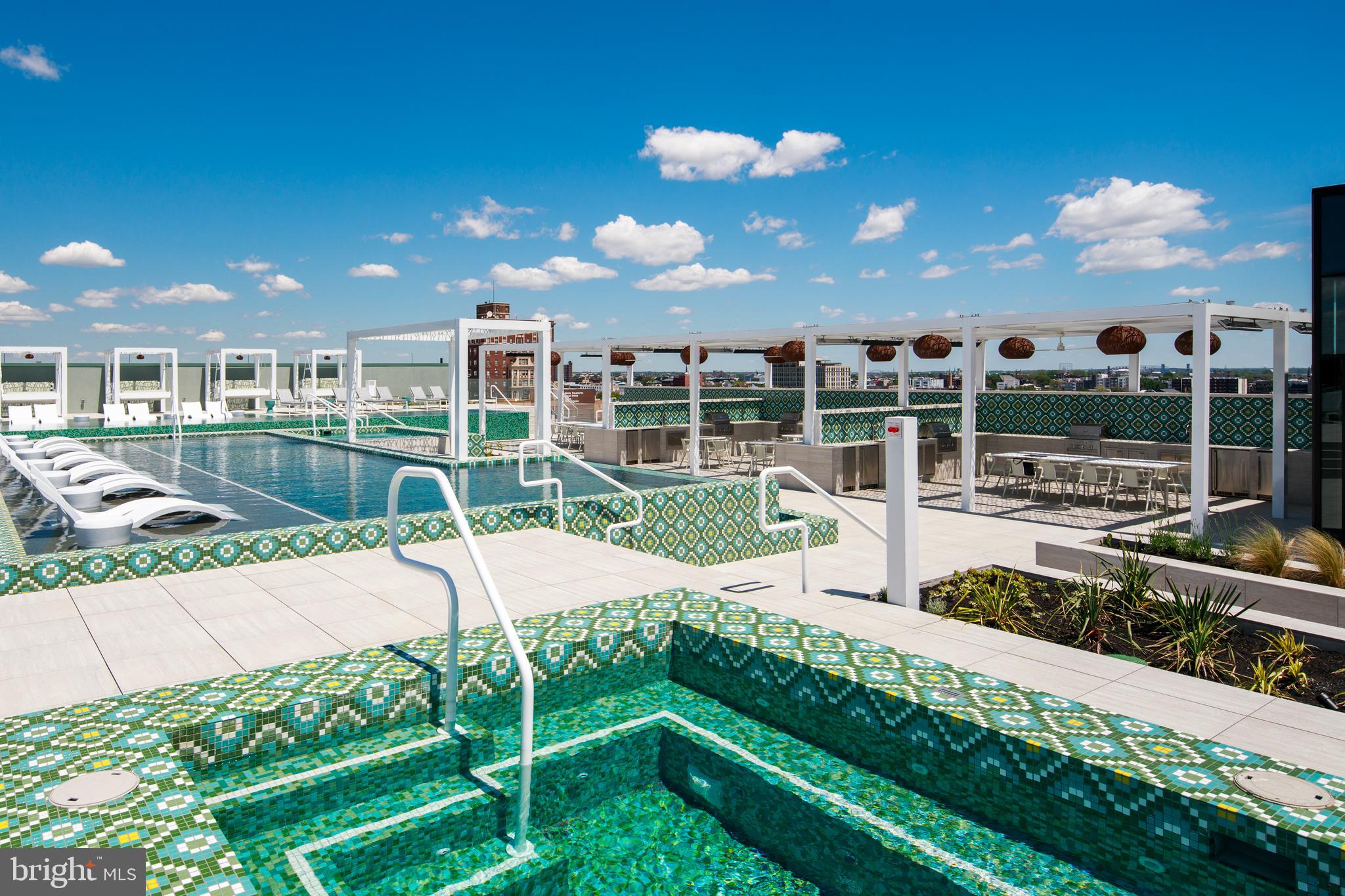 900 North 9th, Unit B Philadelphia, PA 19123 - Photo 4 of 15 a view of a swimming pool with a patio and a yard
