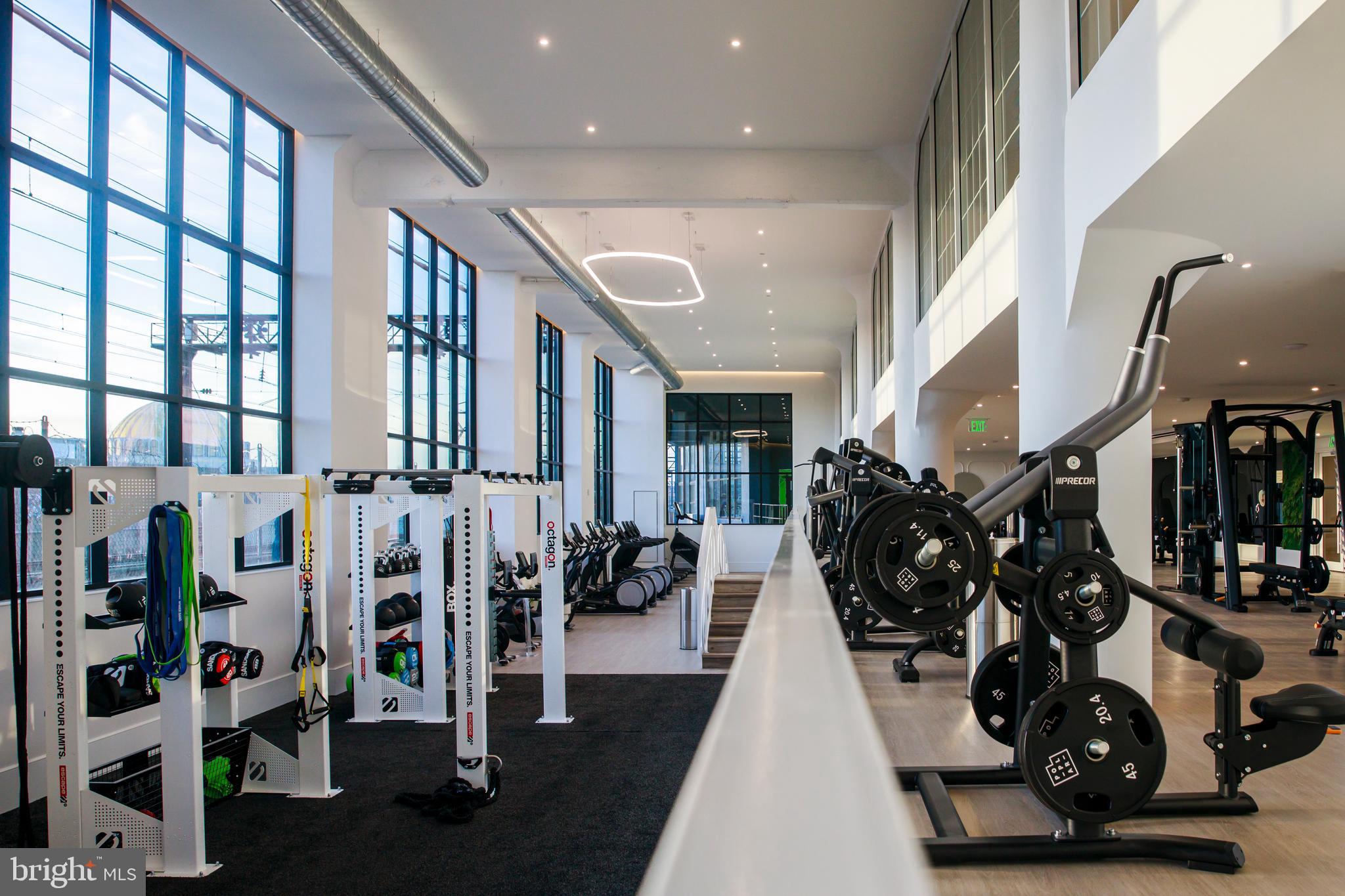 900 North 9th, Unit B Philadelphia, PA 19123 - Photo 7 of 15 a very nice looking living room with lots of gym equipment