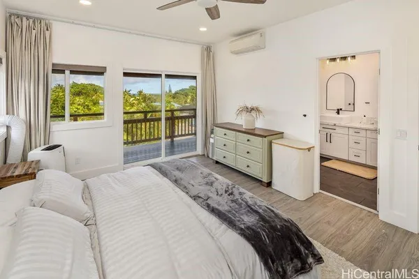 a bed room with a bed and a television