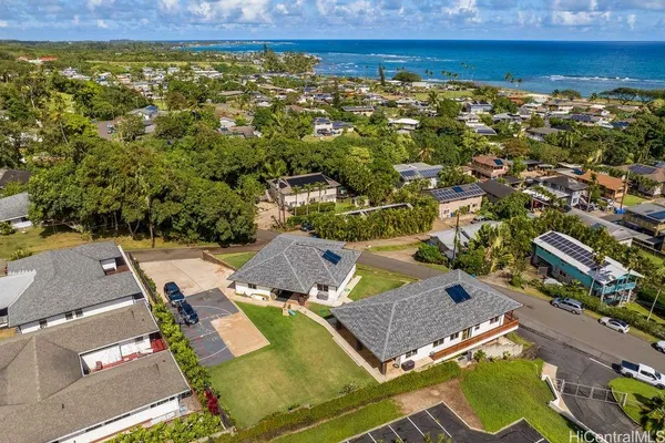 an aerial view of residential houses with outdoor space