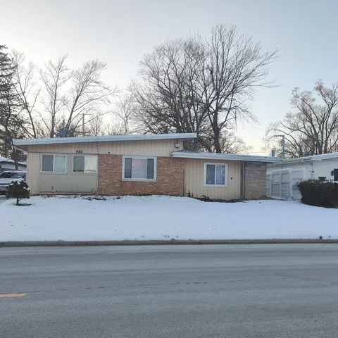 a front view of a house with yard
