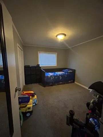 a bedroom with furniture and a window