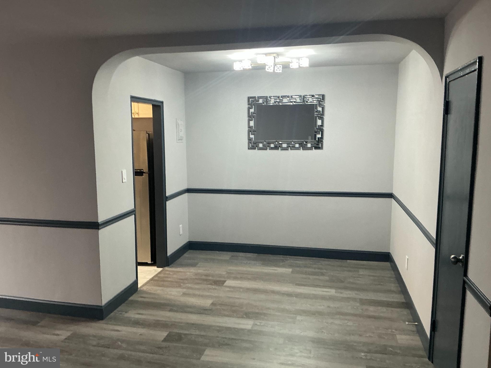 4004 E Street Southeast, Unit 106 Washington, DC 20019 - Photo 11 of 17 a view of wooden floor in a room