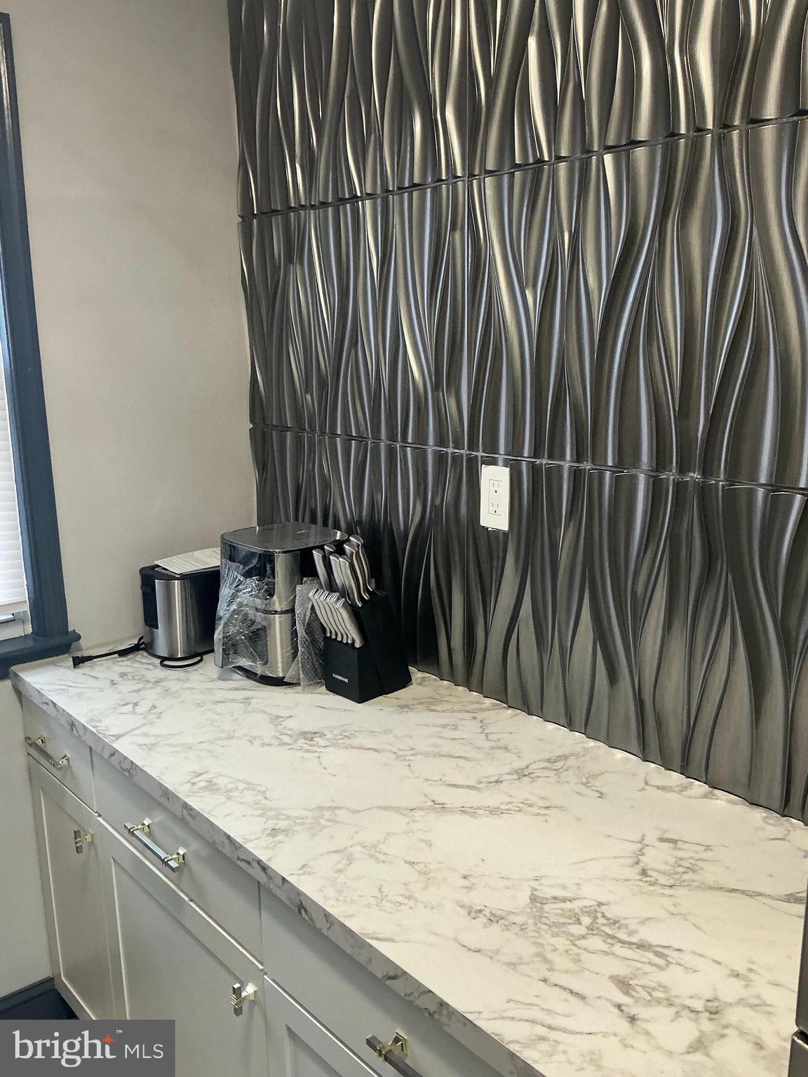 4004 E Street Southeast, Unit 106 Washington, DC 20019 - Photo 4 of 17 a close view of sink and tap