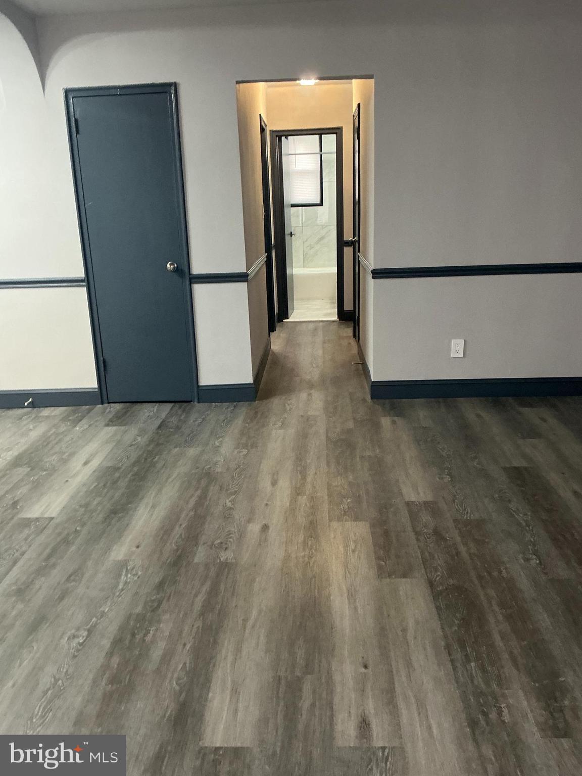 4004 E Street Southeast, Unit 106 Washington, DC 20019 - Photo 9 of 17 a view of a room with wooden floor